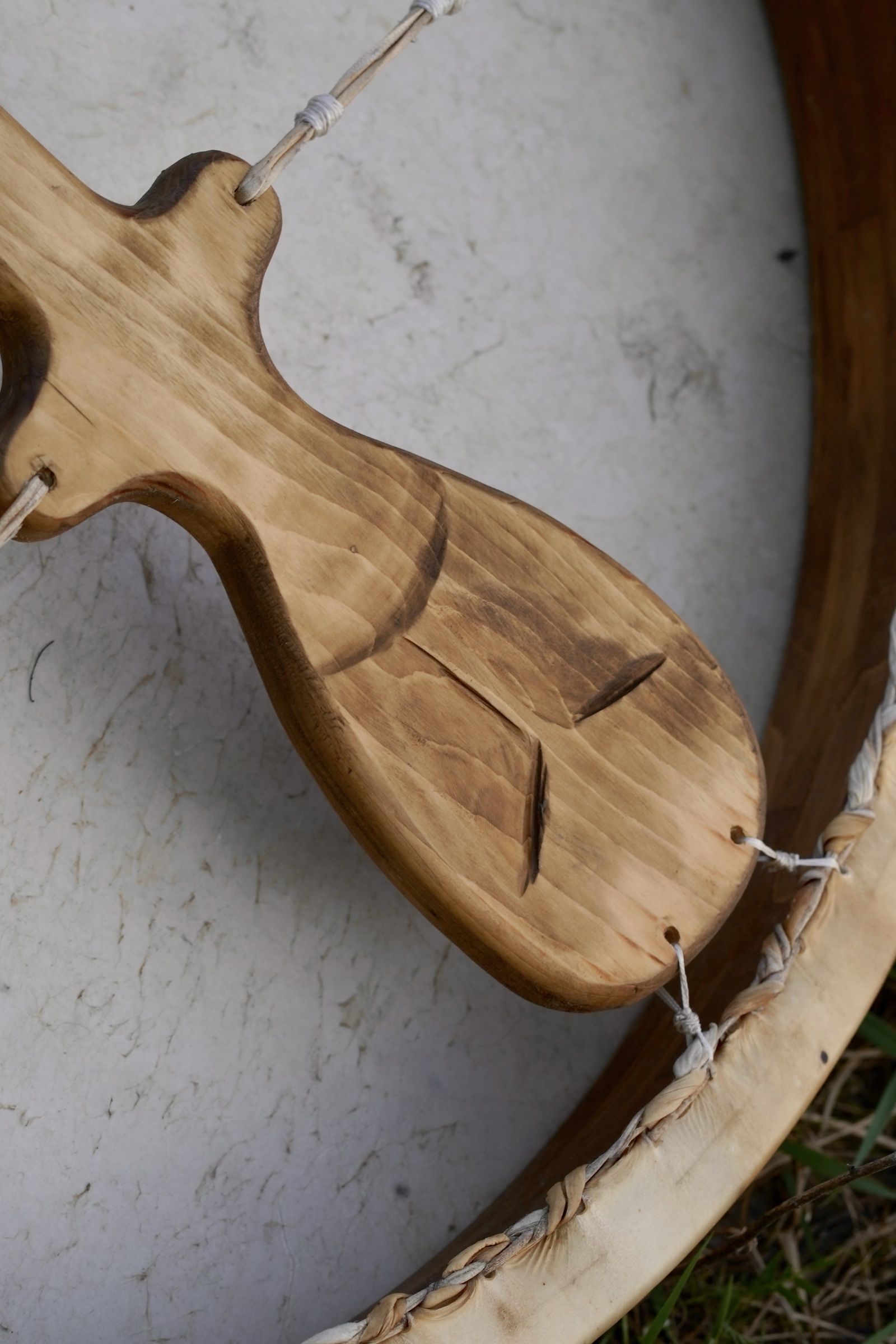 The drum’s carved handle